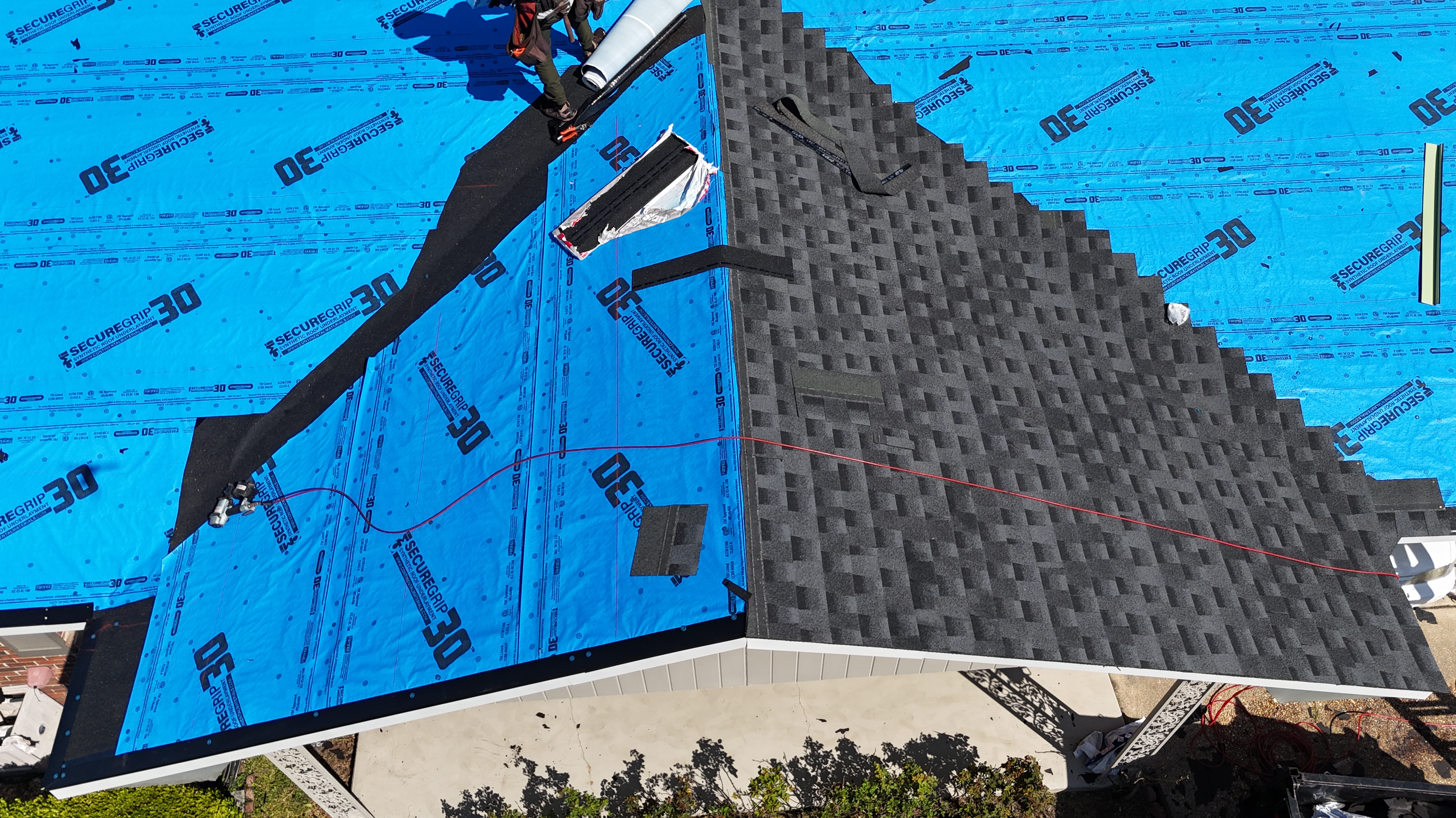 Underlayment and shingles going on
